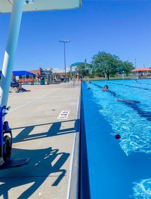 Sitting near the 3'-4' end by the lifeguard