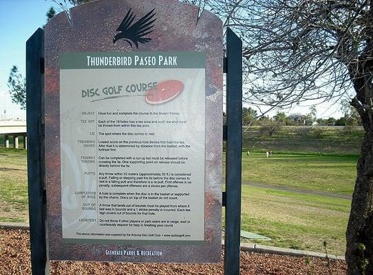 Sign explaining disc golf rules