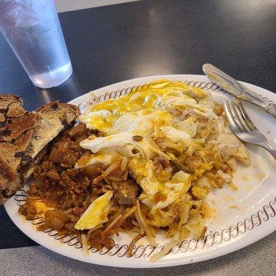 2 eggs, double hash browns and the works toppings.