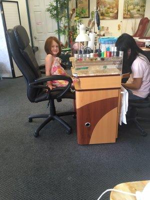 Tatum getting her toes painted!