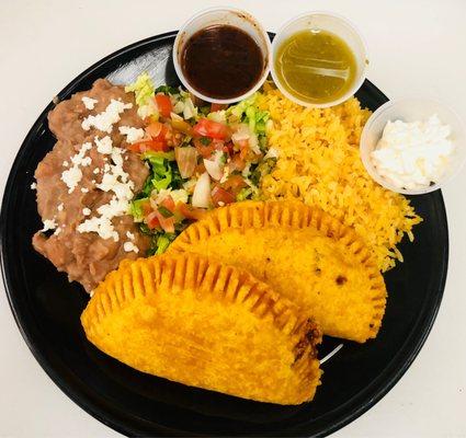 Empanada stuff with choice of meat and melted cheese inside.