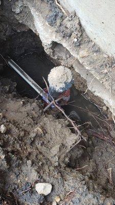 Sprinkler system repaired during foundation lift was snapped and left exposed