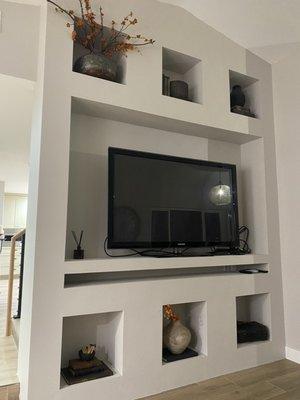 Added entertainment wall with shelves