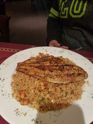 Jerk seasoned Catfish over rice with crawfish.