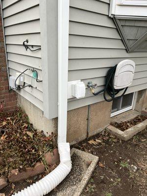 Outdoor receptacles with weatherproof Gfci and in use cover on a decorative siding block