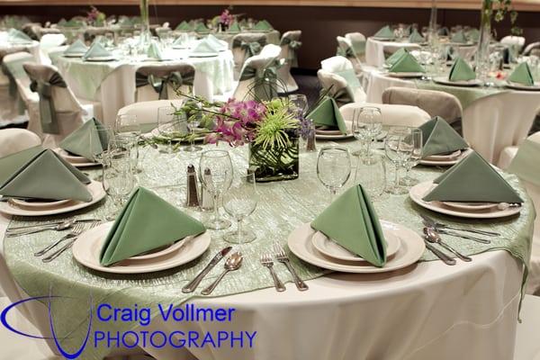 Wedding Reception with Chair Covers and Overlays.   Photo  courtesy of Craig Vollmer Photography.