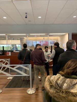 One teller...line out the door. Ridiculous.