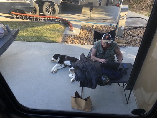 Hubby's outdoor office and one of his assistants!