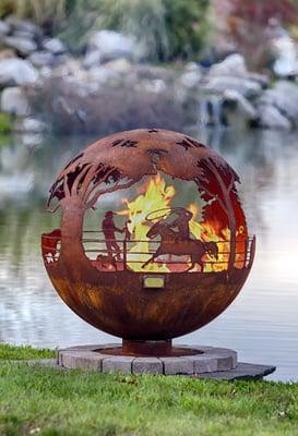 Round Up - 37" Horse/Cowboy theme fire pit sphere by Melissa Crisp of The Fire Pit Gallery. https://www.thefirepitgallery.com/