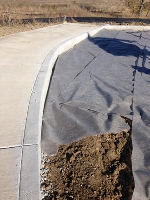 Finished and cured playground curb