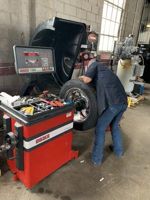 Mounting and balancing tires.