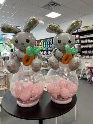 Two balloon bunnies filled with Easter goodies