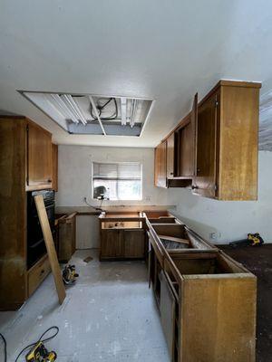 Demolition, installation new tile, recessed light, countertop, stove, fan