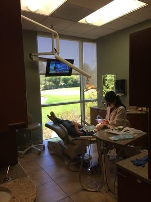 My hygienist working on a patient.