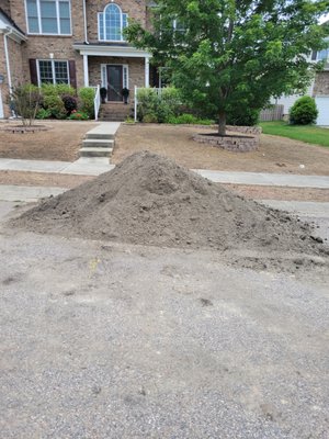 Mound of soil that [He] dropped off in front of my home on the street although he'd been terminated.It still remains in front of my property