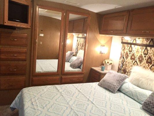 Fleetwood Bounder Master Bedroom with queen bed and plenty of storage.