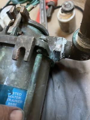 Water strainer with broken fastener bolts