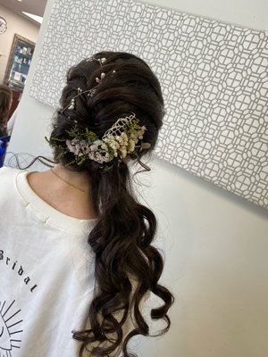 Wedding braid with soft, over-the-shoulder curls.