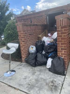 Garbage on the stairs outside of the compactor