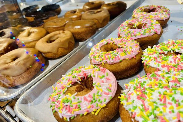 Delicious cake doughnuts with sprinkles