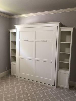 Wall bed with bookshelves