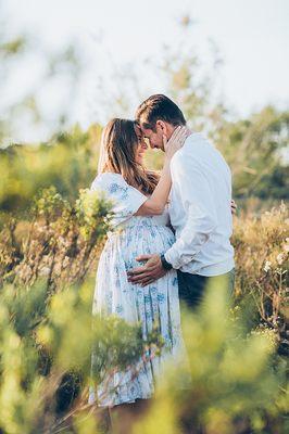 maternity couple in greenery