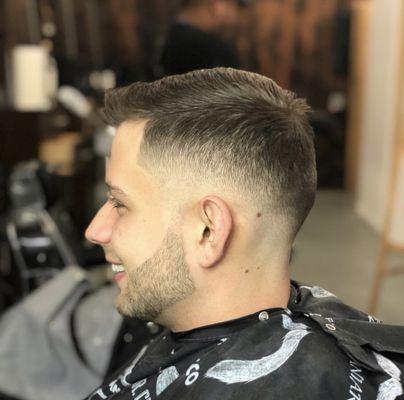 Skin fade with comb over and beard lined up