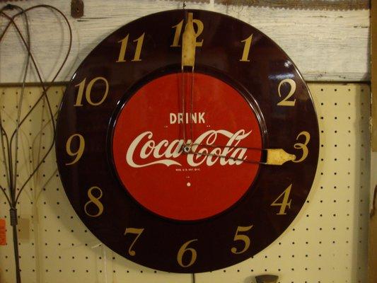 An excellent antique Coca Cola wall clock on one of the basement walls!