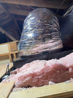 This is the large duct that carries the warm air away from the living area. The large fan is at the end of this duct, hung from the rafters.