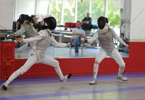 Bout during one of the tournaments hosted at the United Fencing Academy