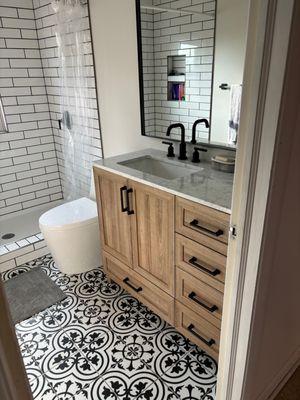 Custom shower and bathroom floor tile.