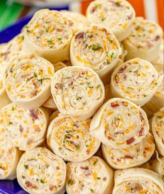 Cracked Chicken Pinwheels  with roasted chicken, bacon, cheddar cheese, creamy ranch spread.