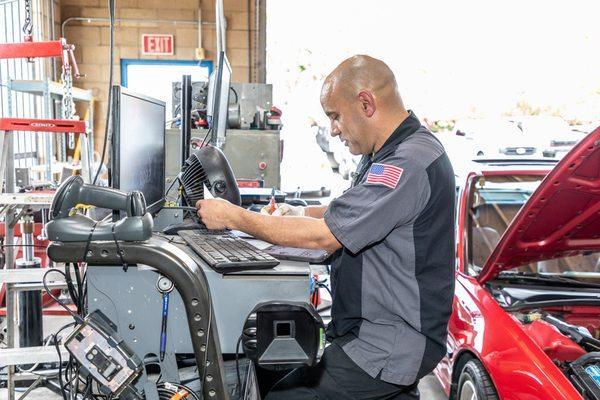 Tony hoping that he taught the car enough for it to pass the "Smog Test"