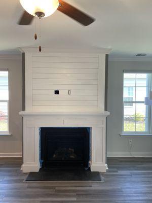 Custom fabricated hearth with shiplap