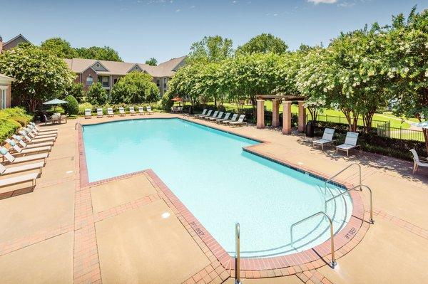 Resort-style swimming pool with surrounding sun deck