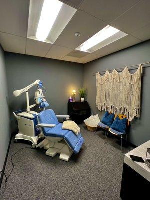 Our TMS treatment room, it also has a TV for patients to enjoy while being treated.