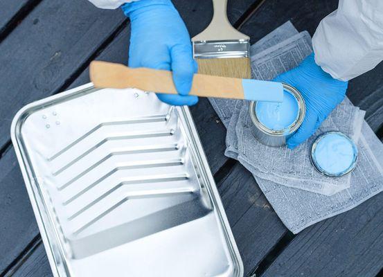 Our technician mixing paint prior to being applied onto wall