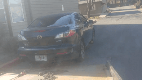 Mac's Mazda parked in the fire lane after a prior warning.