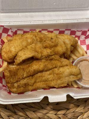 Fish plate with fries and secret sauce. Sauce is not spicy but it's really good. 2 pieces of fish and fries $12.00