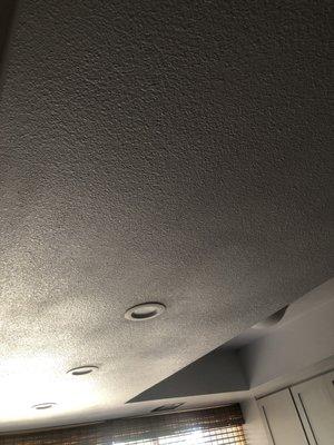 Awful ceiling, looks like inconsistent exterior stucco