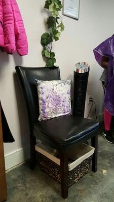 Customer seating. Beautiful purple and black decor.