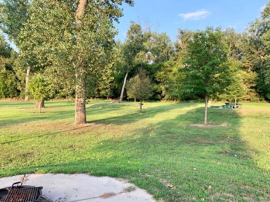 A barbecue pit for grilling. Loads of grassy space around you.