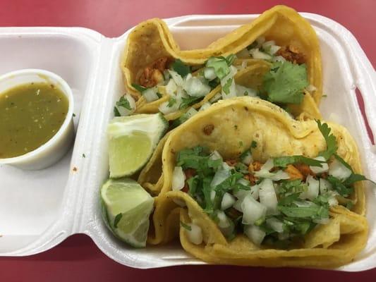 Soft chicken tacos, with onions, cilantro and green sauce!