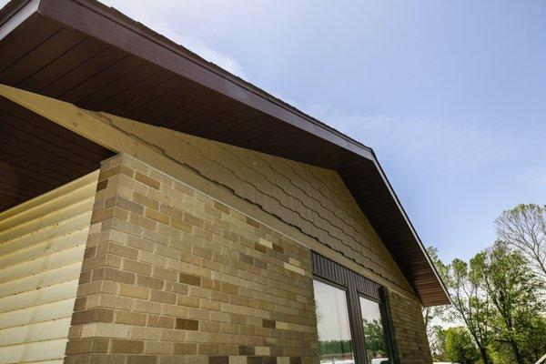 Installed shake siding on the gable peaks