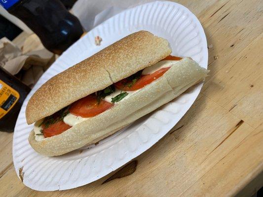 A Caprese sandwich delicious bread fresh mozzarella, tomato and basil with balsamic drizzle. My fave.