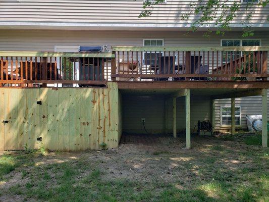 Enclosed portion of deck for she'd storage. Pre staining.