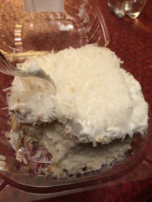 Massive white cake with white frosting and coconut