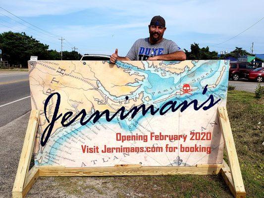 Clayton Jernigan (owner) with our new road-side sign.