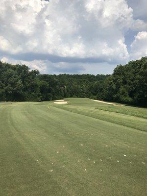 Long rectangular green with a big swale across be middle