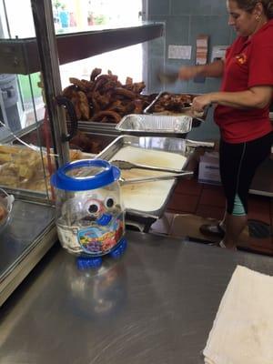 Cutting up Chicharrones.